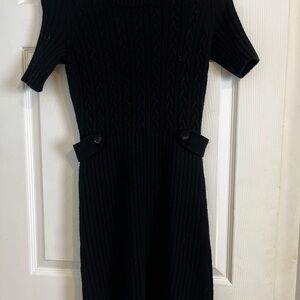Black cashmere sweater dress.  Buttons on the side